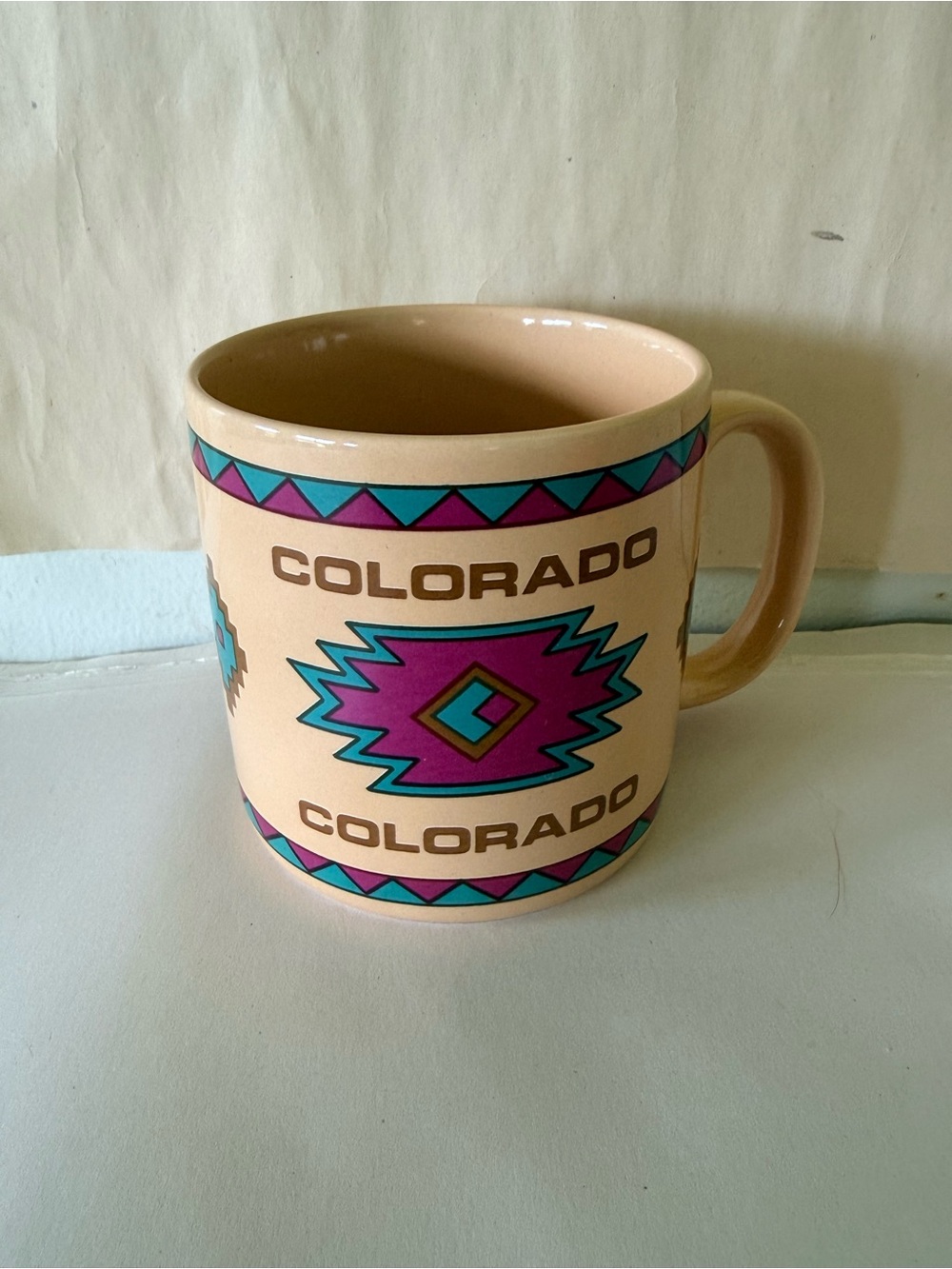 Colorado Souvenir Mug in Peach with Teal & Purple Southwestern Design
